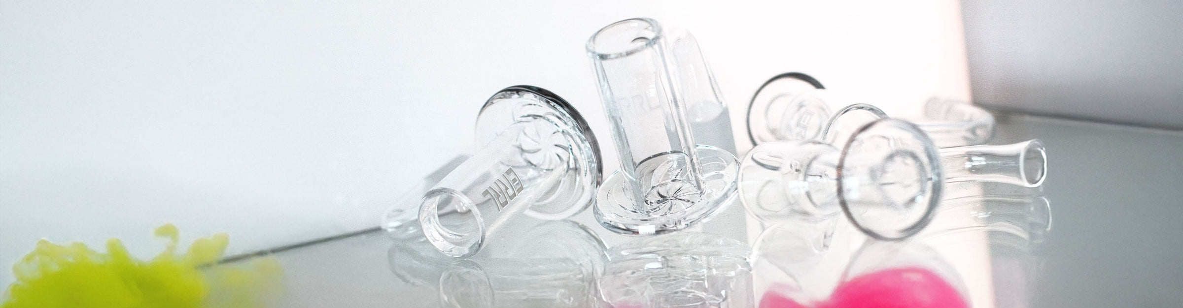 Bangers Collection Banner Image with several glass bangers resting on reflective display platform