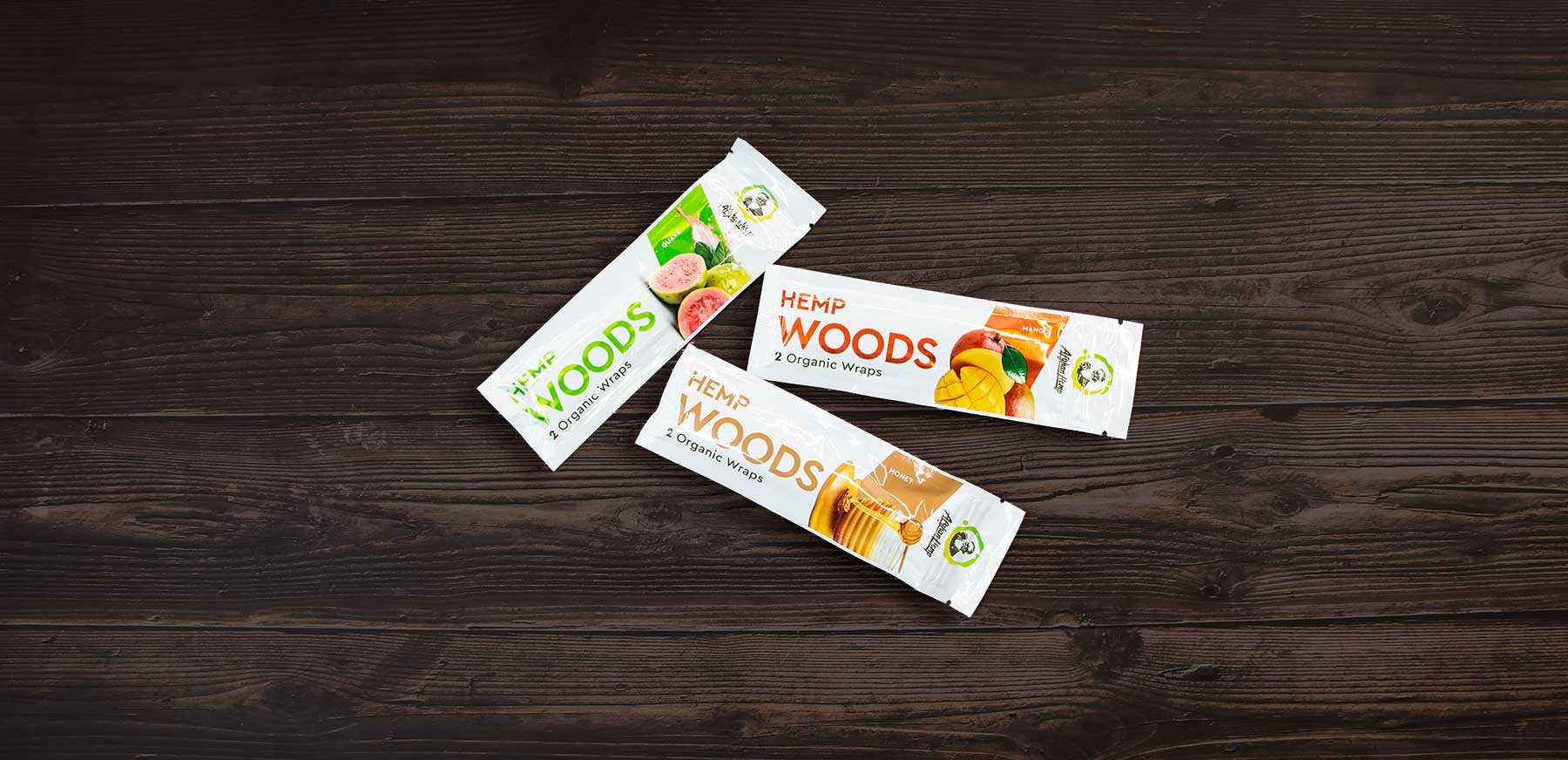 Wholesale Blunt Wraps laying down on a dark wooden table