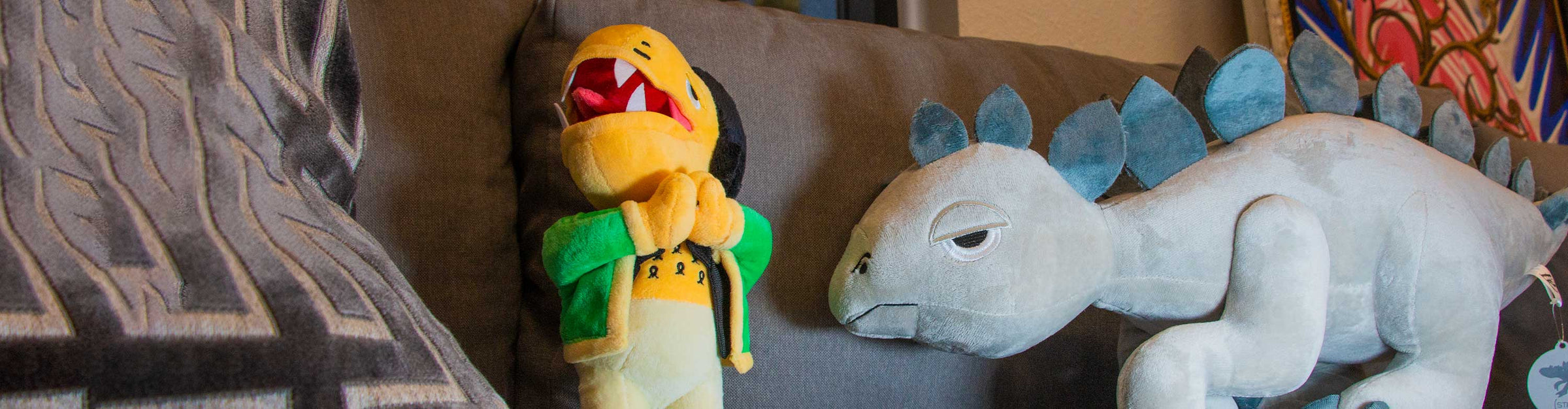 Wholesale Elbo Plush Figures sitting on couch inside office