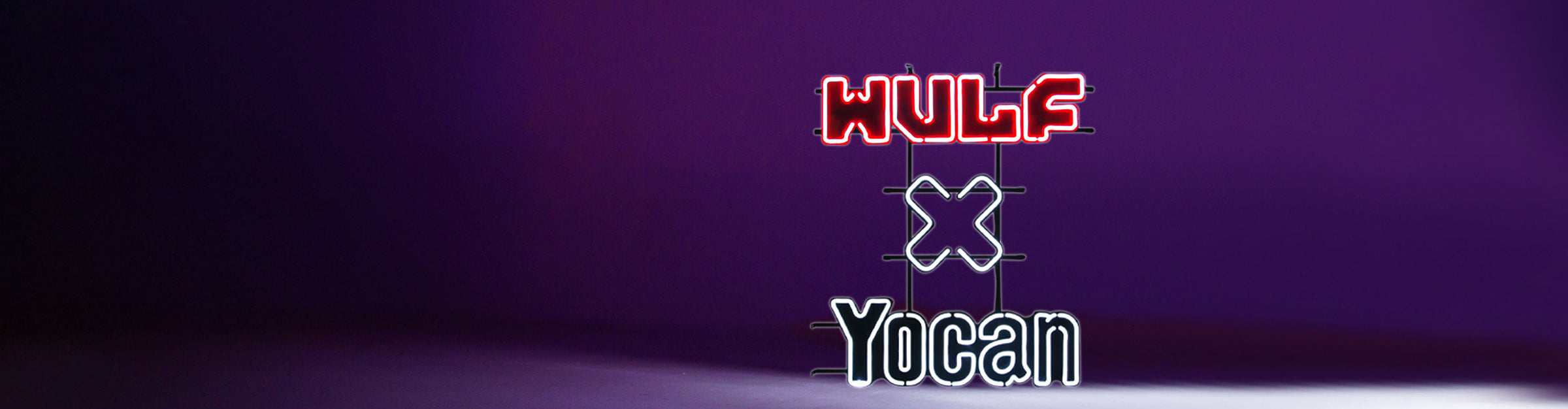 Got Vape Wholesale Wulf x Yocan Neon Sign inside studio with purple lighting