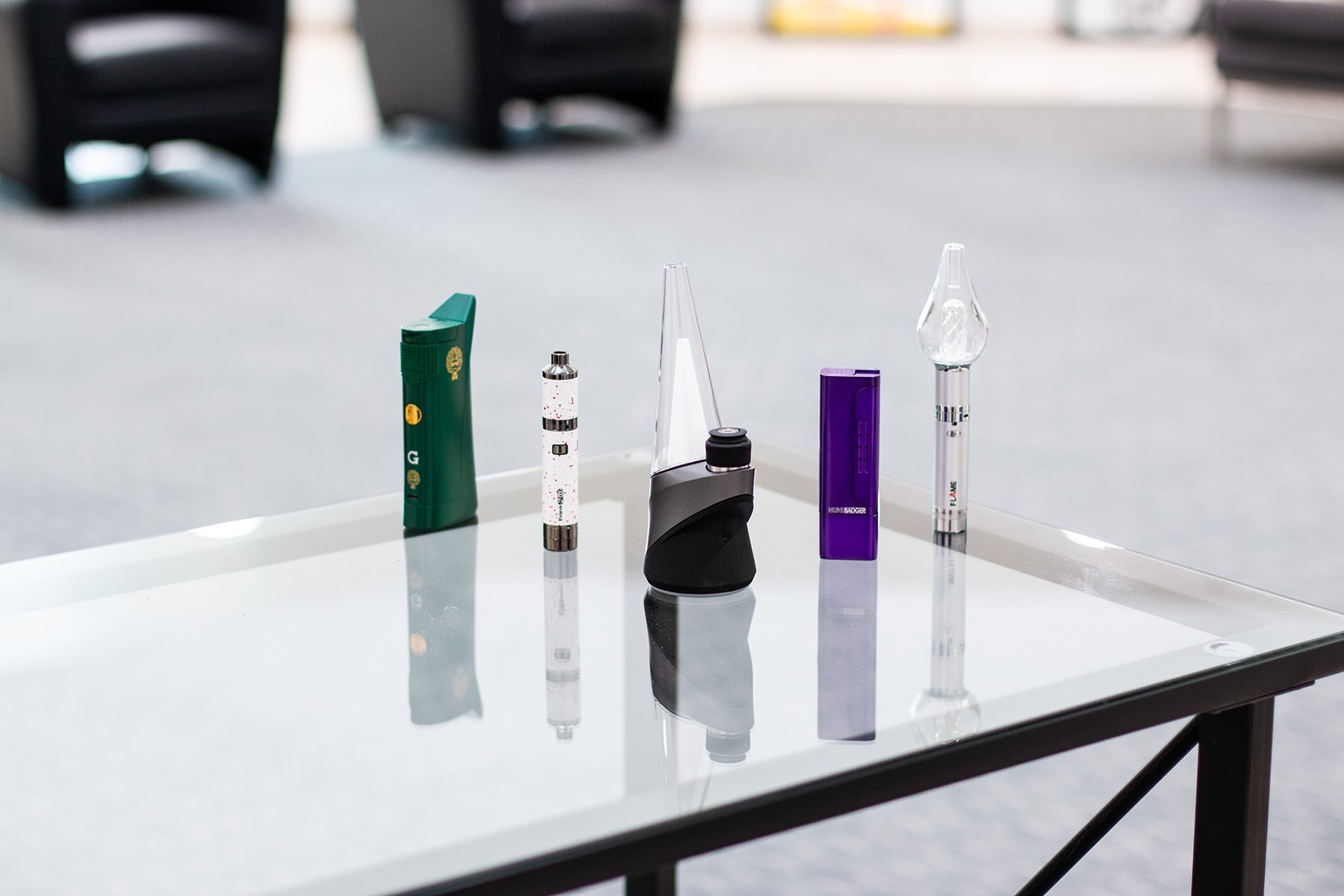 Wholesale Concentrate Vaporizers mixture of various Concentrate vaporizers standing in office lobby on glass table