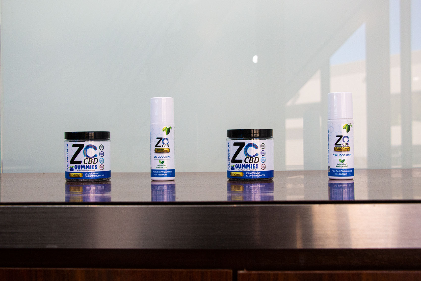 Zo CBD Wholesale products standing on table inside office building